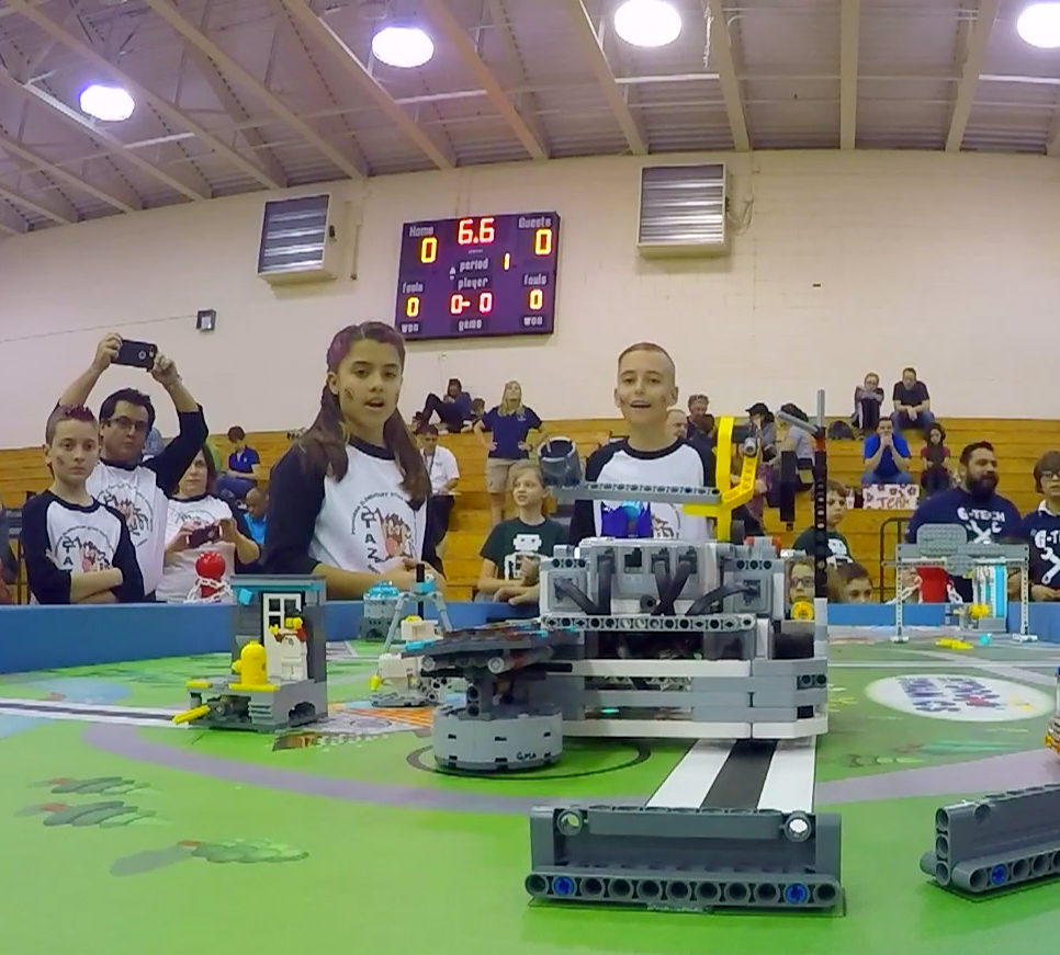 Children competing in Lego block competition.
