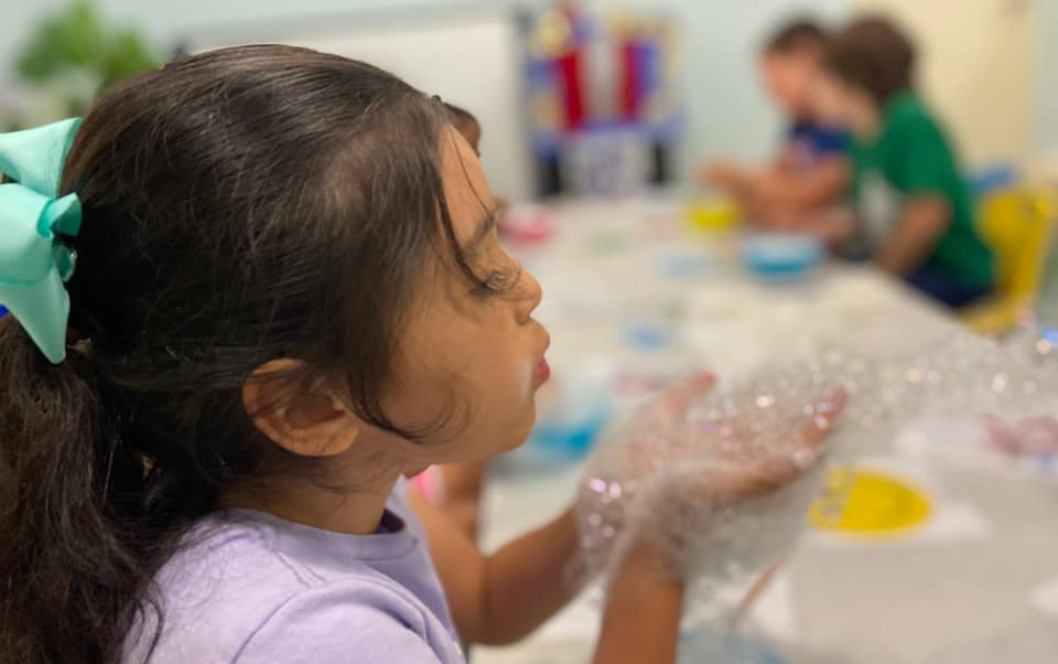 Girl blowing bubbles