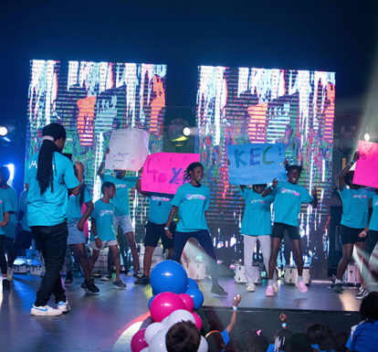 Group of children singing song.