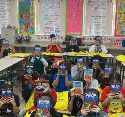 Children at Barton Elementary School hold up books they chose as part of Leadership Palm Beach County's 2025 Education Day reading event.