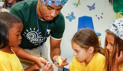 Child care counselor playing with children.