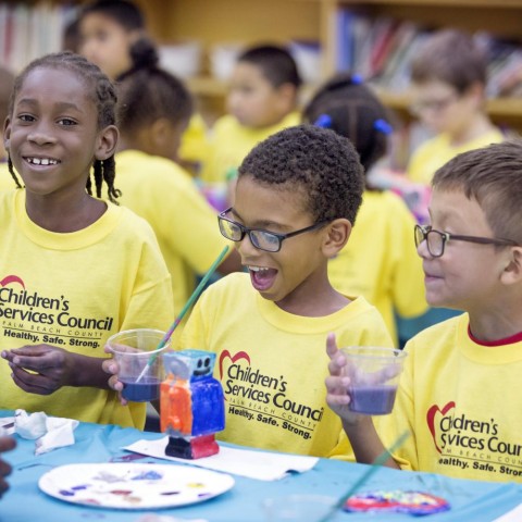 school age, black, hispanic, multiracial, sitting, smiling, painting, coloring, happy, girl, boy, student, classroom