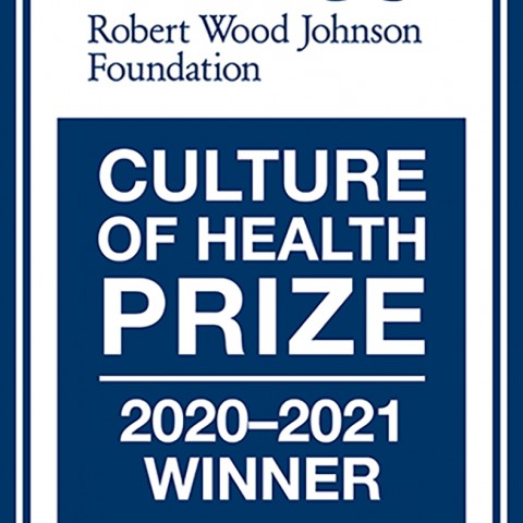 Blue logo with white writing that says Robert Wood Johnson Foundation Culture of Health Prize 2020-2021 Winner