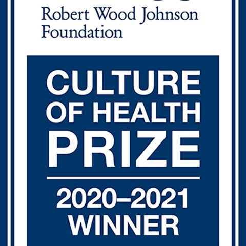 Blue logo with white writing that says Robert Wood Johnson Foundation Culture of Health Prize 2020-2021 Winner